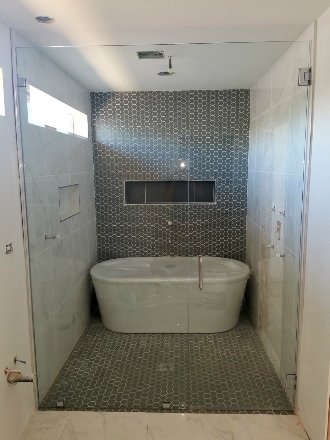 Custom tiled shower and bathtub remodel